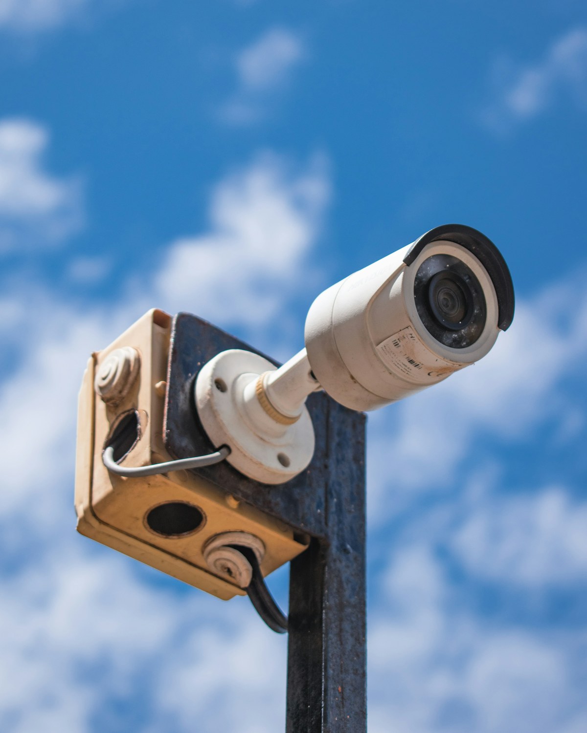 Outdoor security camera mounted on a building